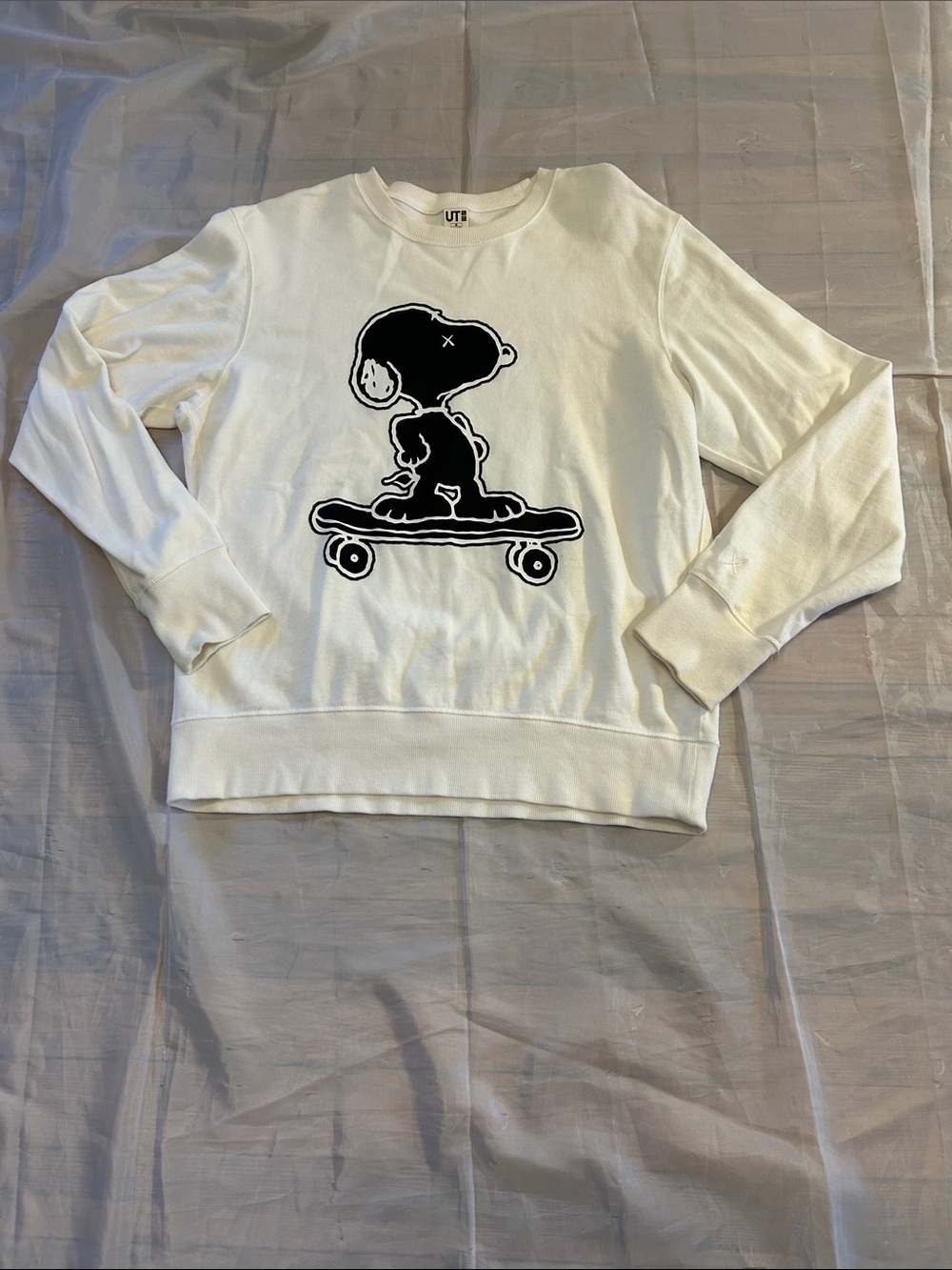 Uniqlo White Crewneck Sweatshirt with Black Skateboarding Snoopy Graphic